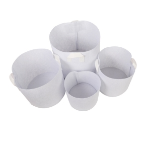 White non-woven planting bags with two handles
