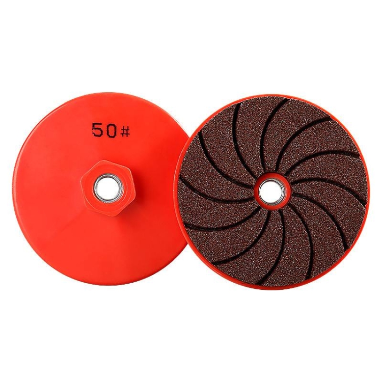 Integrated stone dry grinding pads