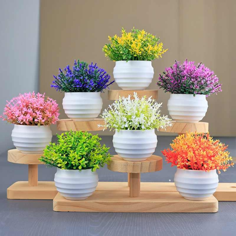 Artificial succulent plant in a white flower pot