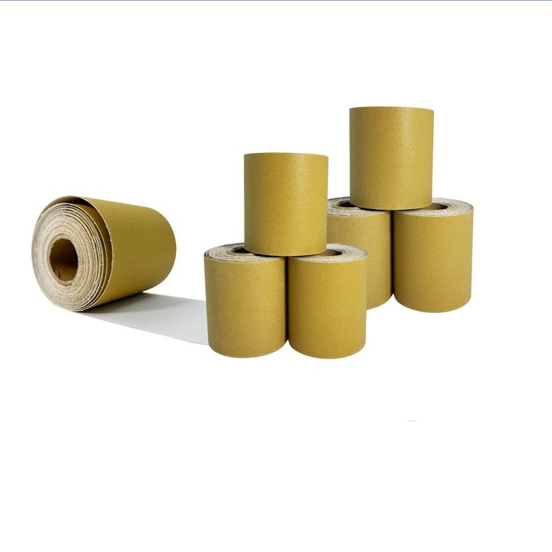 Hand-torn yellow adhesive sandpaper roll