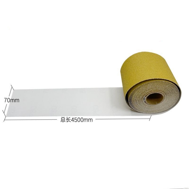 Hand-torn yellow adhesive sandpaper roll
