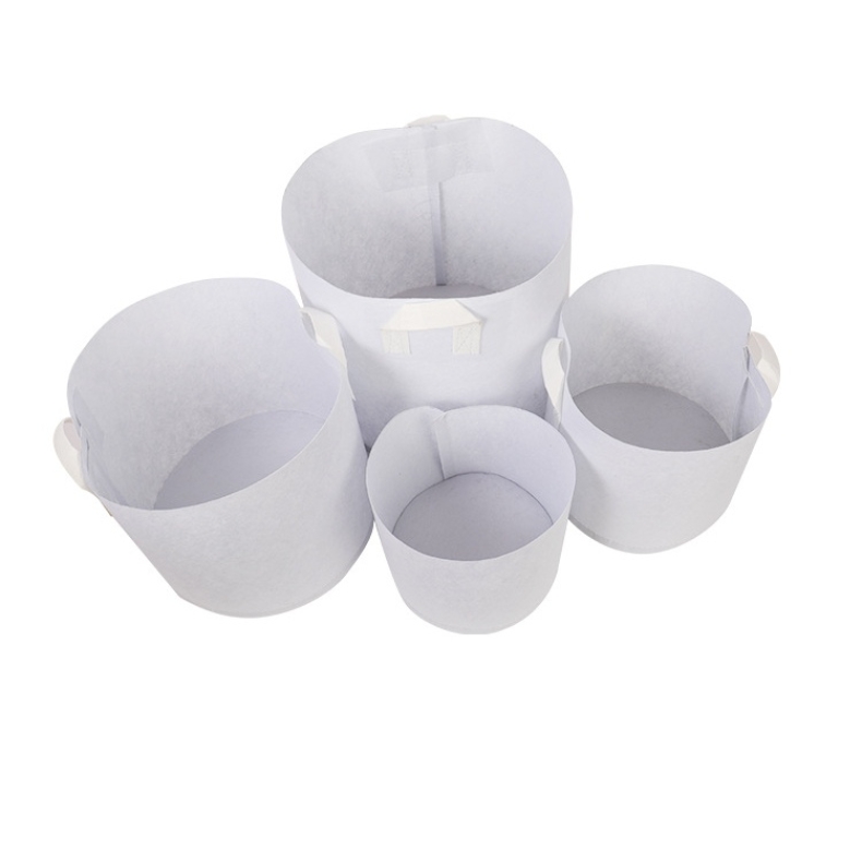 White non-woven planting bags with two handles