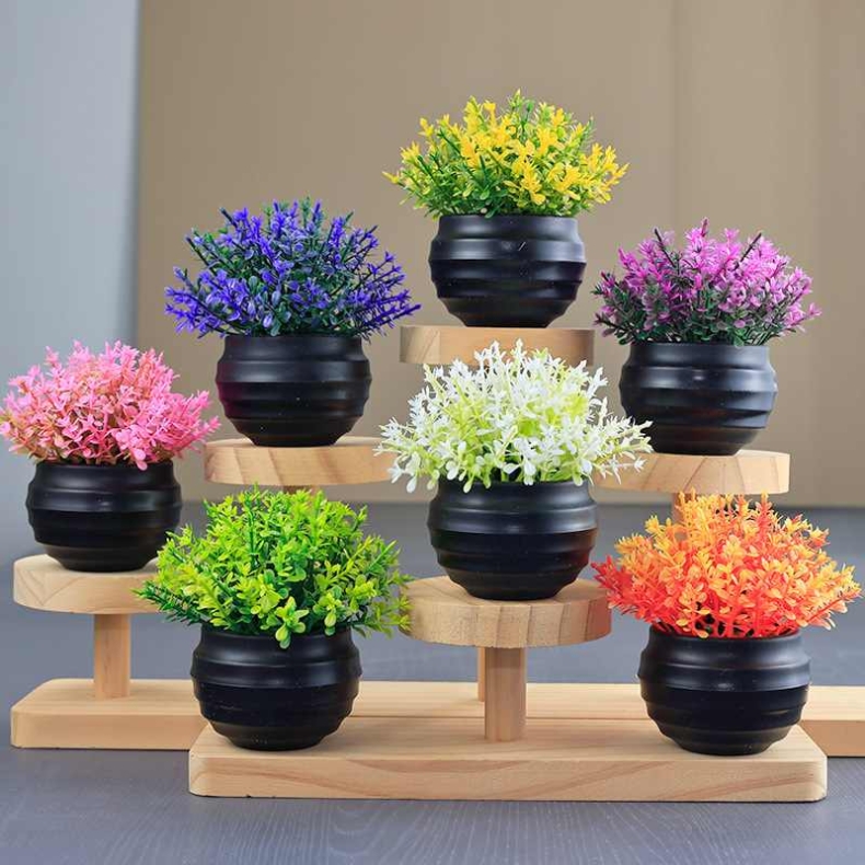 Artificial succulent plant in a black flower pot