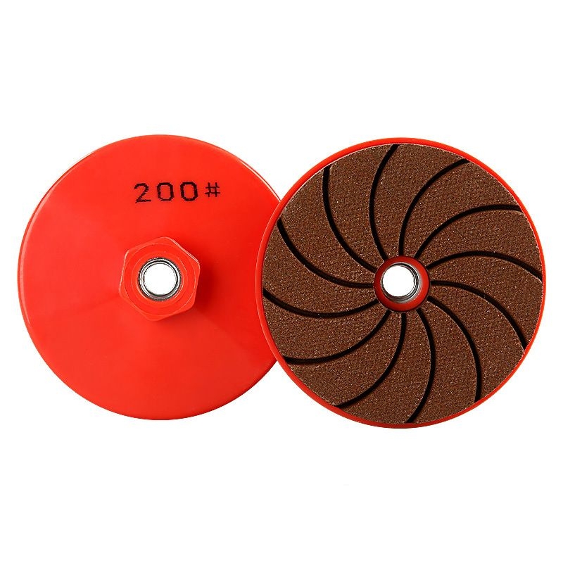 Integrated stone dry grinding pads