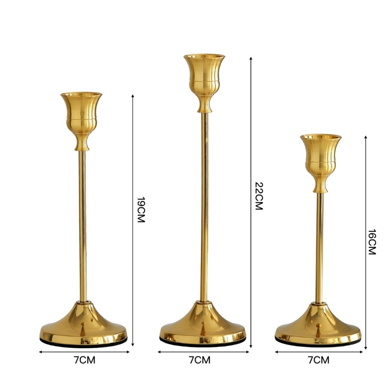 Gold, silver, and black candlestick three-piece set