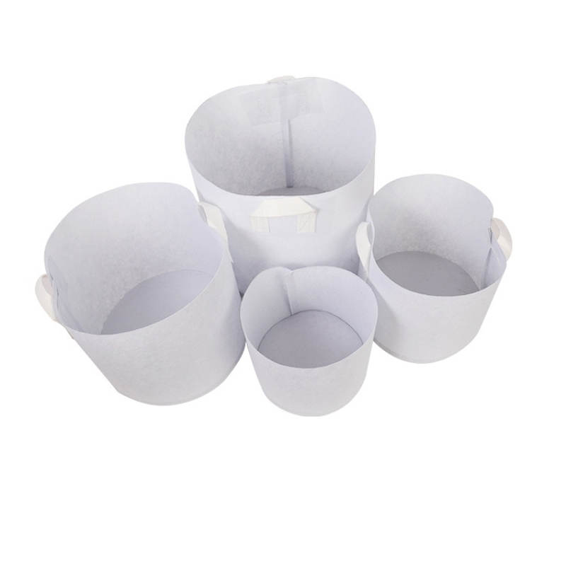 White non-woven planting bags with two handles