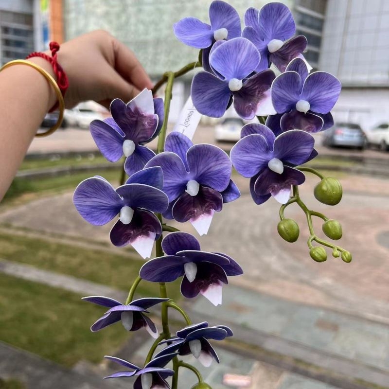Two branches of artificial butterfly orchids