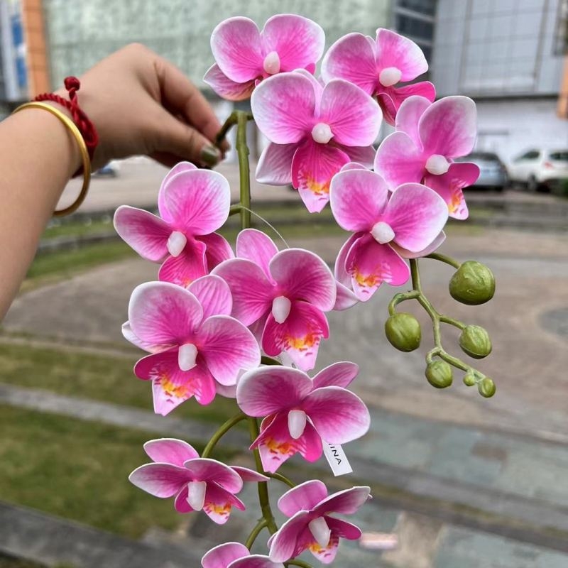 Two branches of artificial butterfly orchids