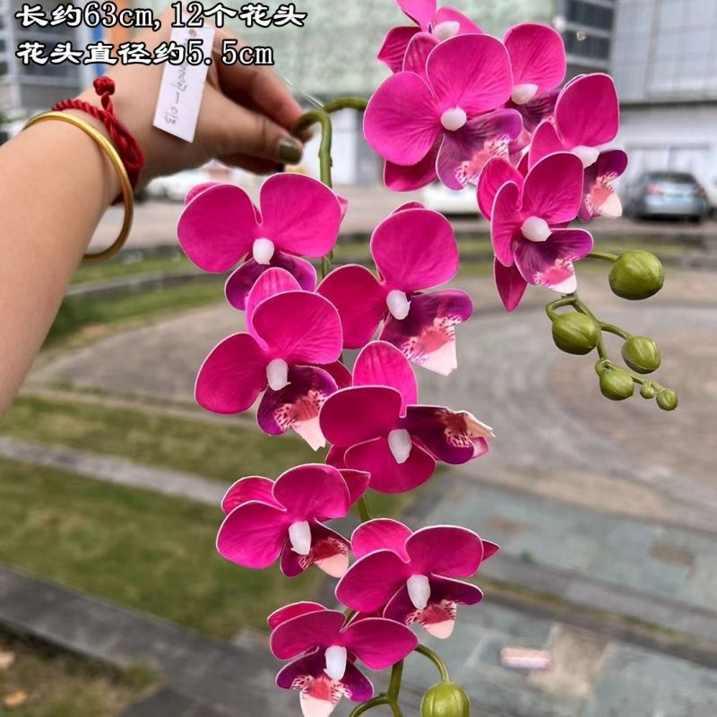 Two branches of artificial butterfly orchids