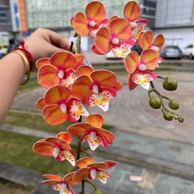 Two branches of artificial butterfly orchids