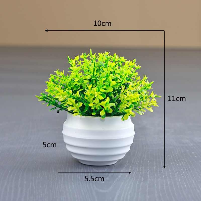 Artificial succulent plant in a white flower pot