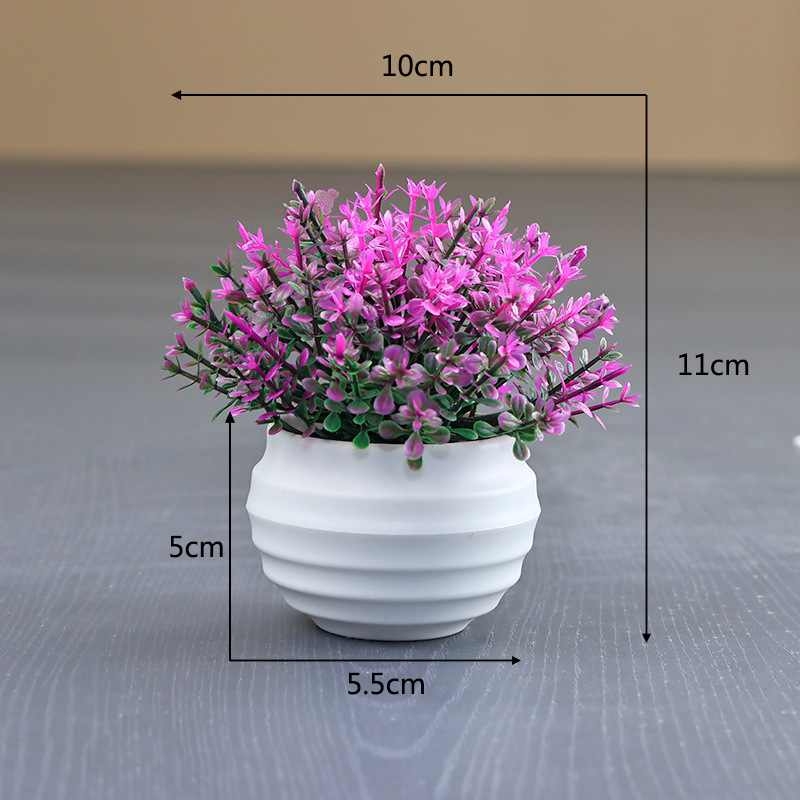 Artificial succulent plant in a white flower pot