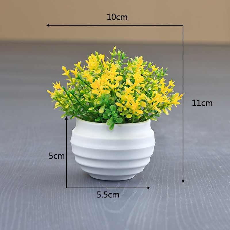 Artificial succulent plant in a white flower pot