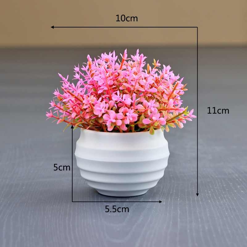 Artificial succulent plant in a white flower pot