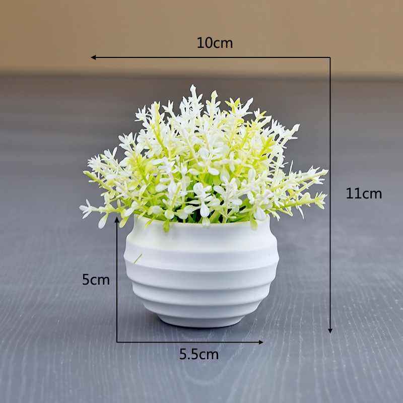 Artificial succulent plant in a white flower pot