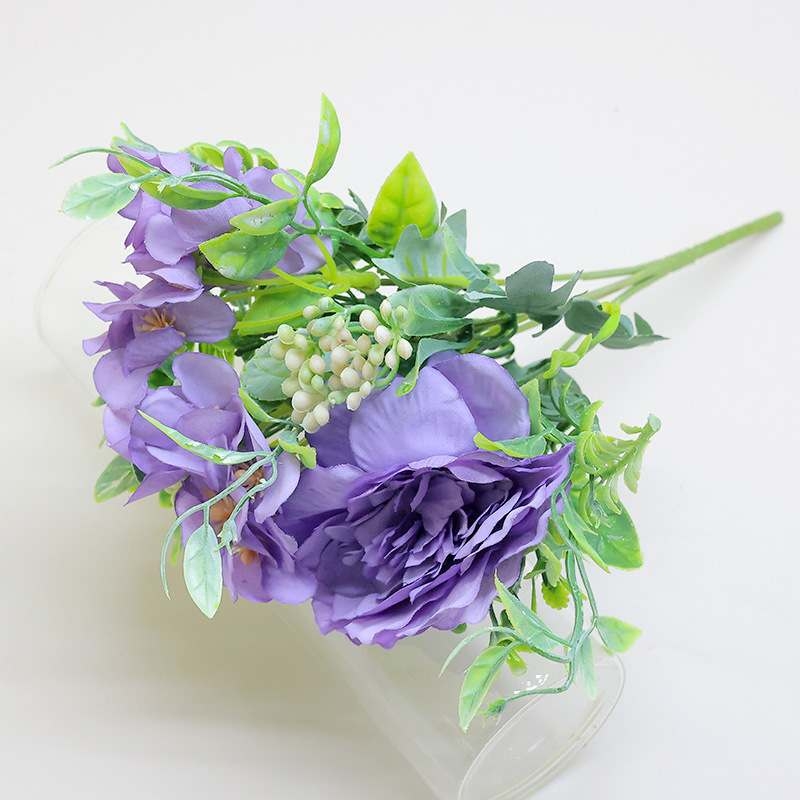 Artificial roses and camellias bouquet