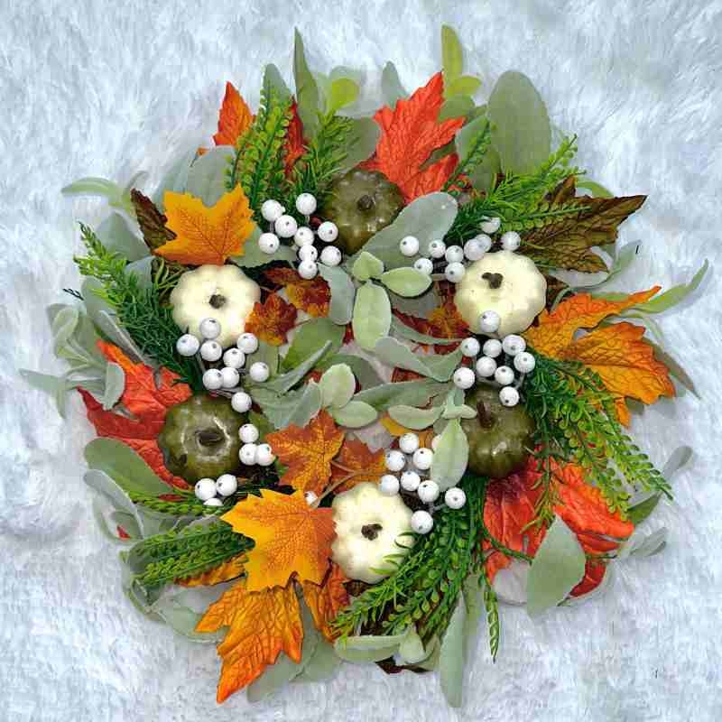 Plastic white pumpkin and maple leaf wreath