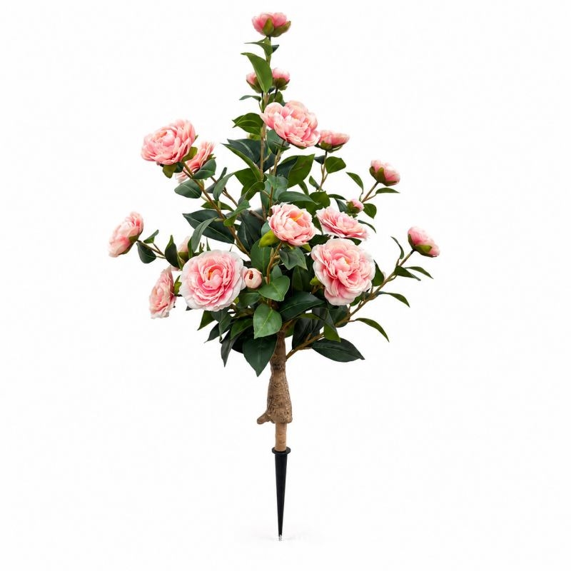 Artificial camellias planted in the ground
