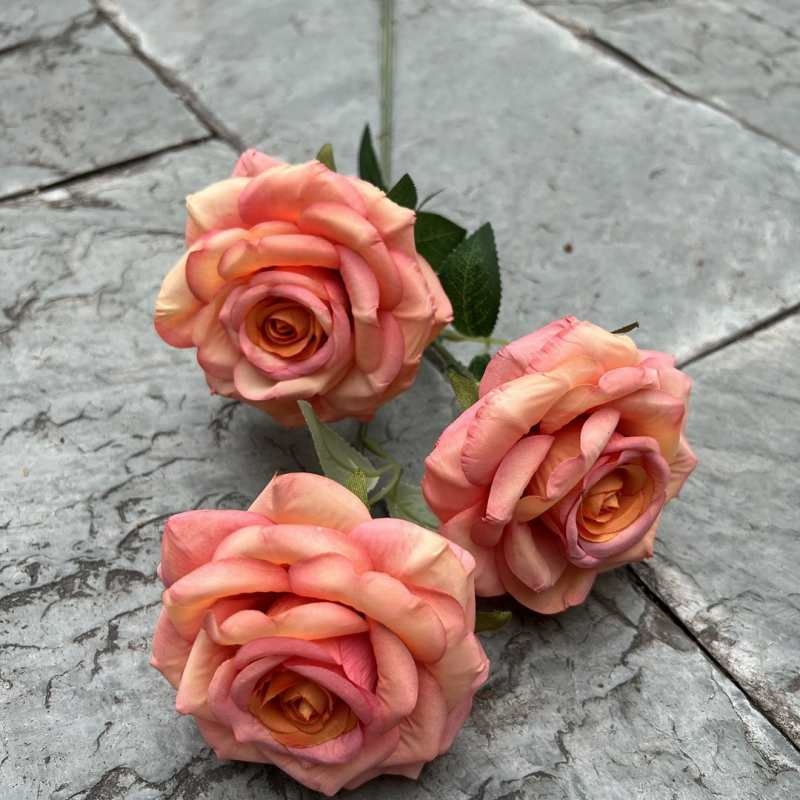 Simulated roses with three flower heads and curled edges