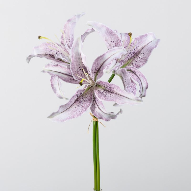 Artificial flower bouquet containing 3 lilies