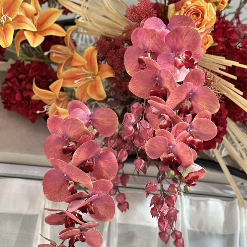 Multi-colored artificial Phalaenopsis orchids with a hand feel