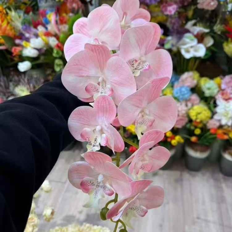 Multi-colored artificial Phalaenopsis orchids with a hand feel