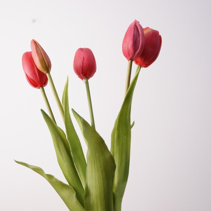 A bouquet of artificial tulips with five flowers