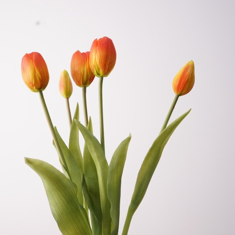 A bouquet of artificial tulips with five flowers