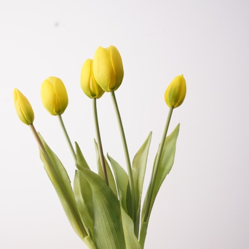 A bouquet of artificial tulips with five flowers