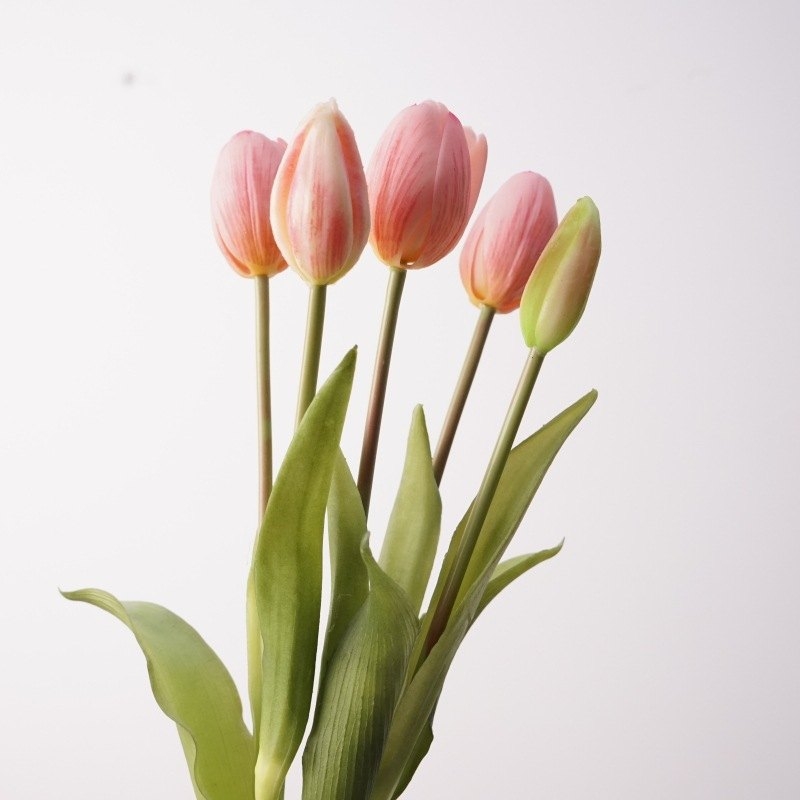 A bouquet of artificial tulips with five flowers