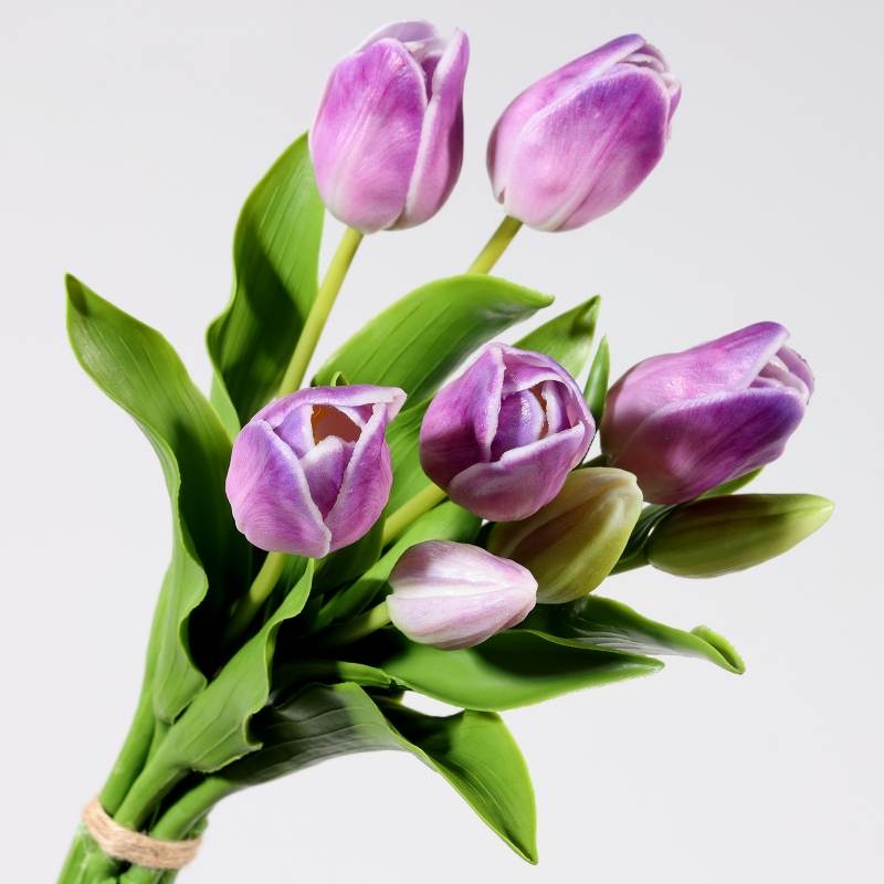 A bouquet of artificial tulips with 7 flowers