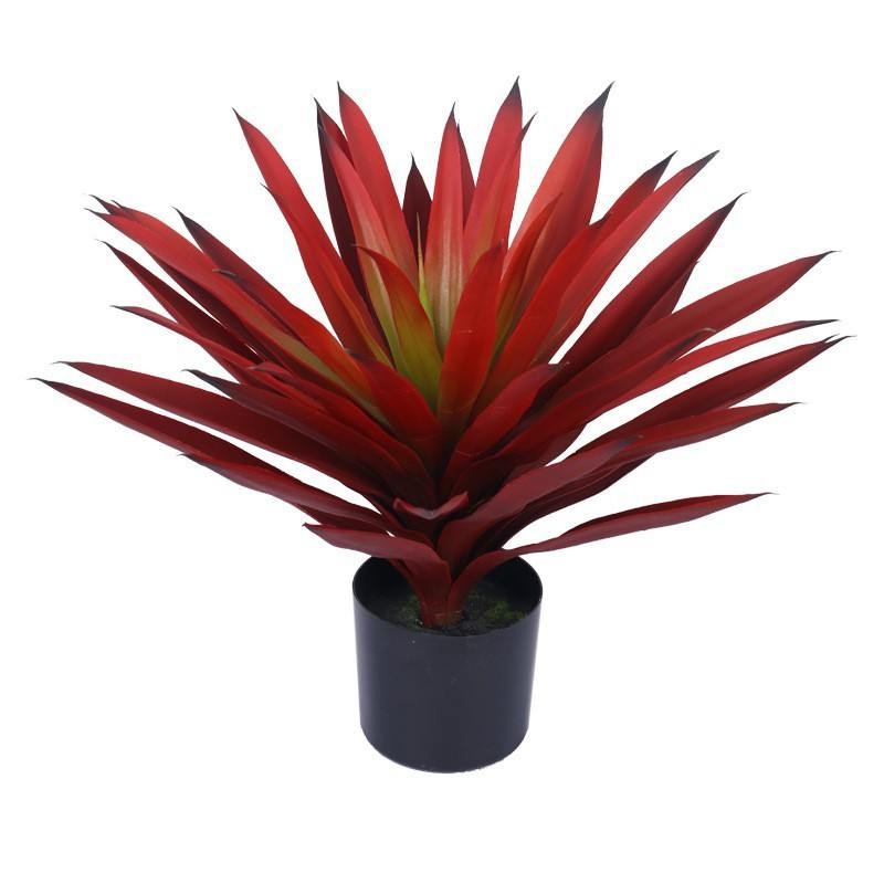 Artificial red agave plant in a black plastic pot